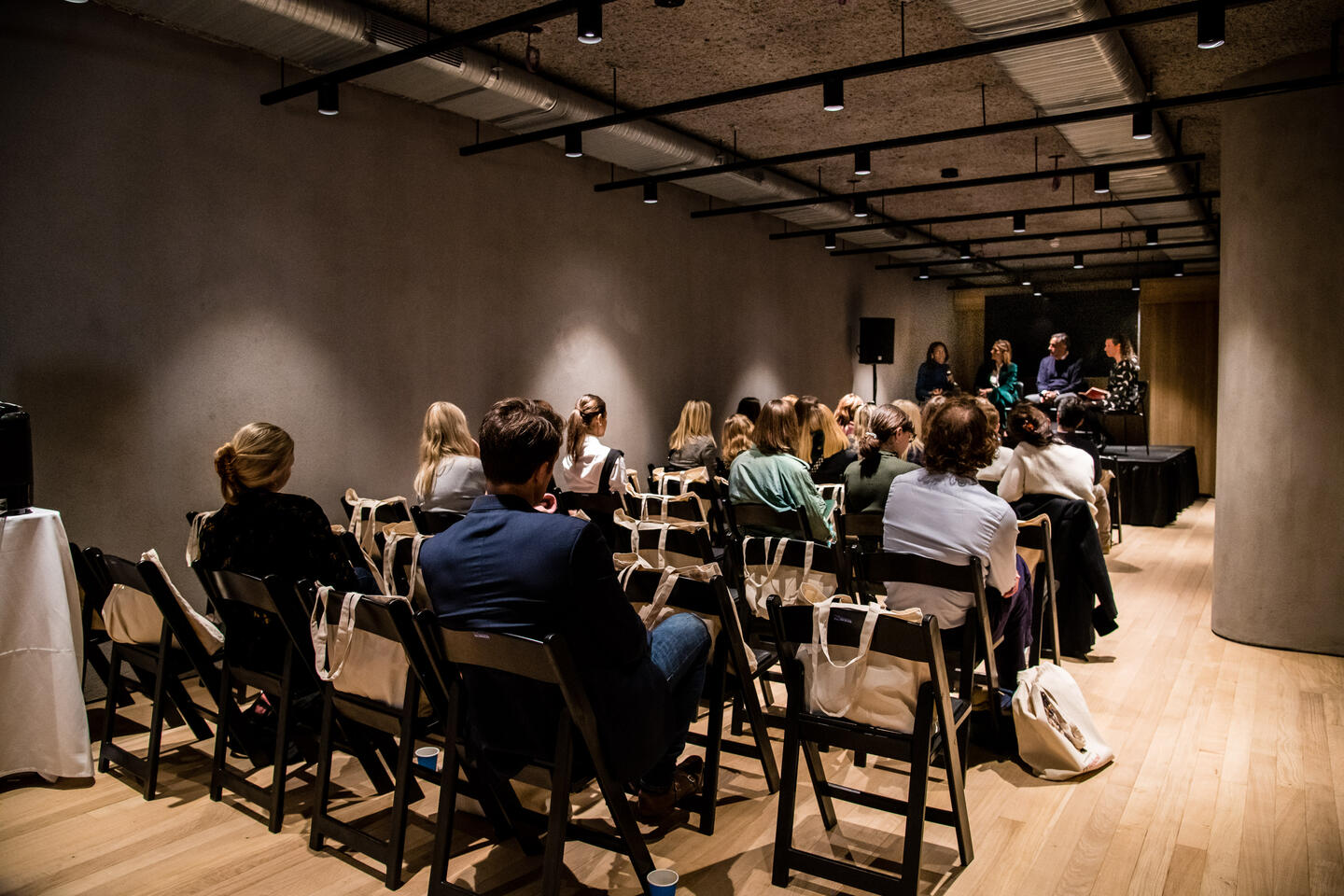 People sat down watching a talk